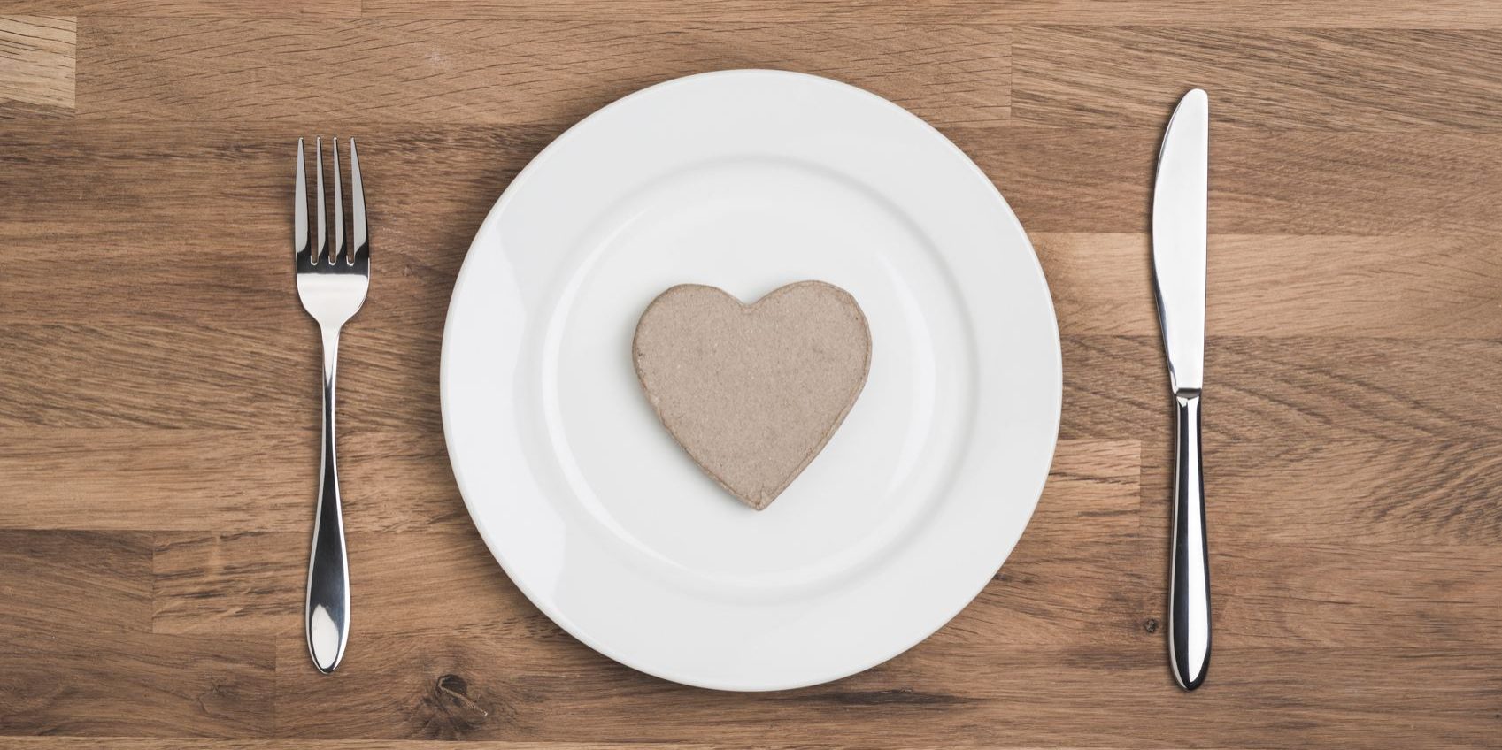 love your favourite food concept, heart on white plate overhead shot